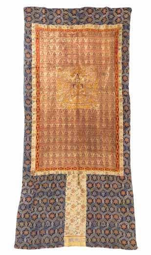 933 934 933 A Silk Panel of rectangular form, the center having a square panel showing a seated bodhisattva enclosed by various Buddhist