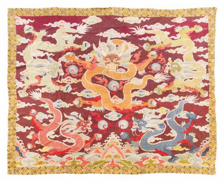 940 940 An Embroidered Silk Rectangular Panel having a forward-facing dragon in the center chasing the laming pearl, surrounded by two pairs of confronting dragons