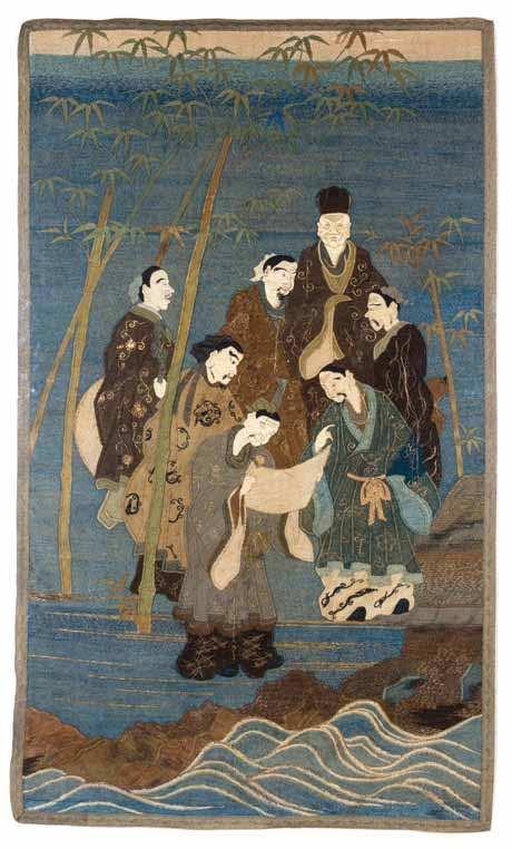 943 A Japanese Embroidered Tapestry executed in a knotted stitch, depicting the seven sages of the bamboo grove, the igures depicted examining a handscroll, their robes with