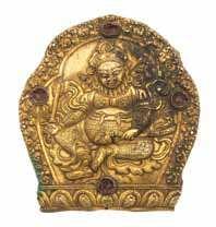 945 946 947 948 949 951 945 A Sino-Tibetan Bronze Figure of Buddha the igure seated in dhyanasana on a lotus base, both hands raised up to the chest in harina, wearing high-waisted garments and a
