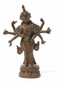 950 A Gilt Bronze Figure of an Eleven-Headed Avalokitesvara the bodhisattva depicted standing, wearing a lowing dhoti embellished with elaborate jewelry, the principal hands in namaskara mudra with