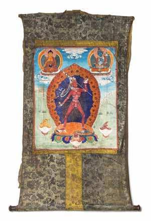 $1,000-2,000 992 A Tibetan Thangka the deity depicted in the center standing on two human igures before a mandala atop a lotus plinth, the left hand raised bearing a skull and the right hand holding