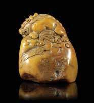 179 A Carved Hardstone Seal Stamp surmounted with a igure of a qilin. Height 2 3/4 inches. 179 180 A Hardstone Seal Stamp having carved decoration above the squared seal base. Height 2 5/8 inches.