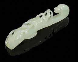 Katz, Boulder, Colorado 345 347 342 A Jade Belt Hook of a pale celadon stone, having a dragonhead terminal with a chilong crawling on the shaft, together with a