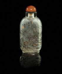 Property from a Private Collection, Michigan $800-1,200 473 A Yellow Peking Glass Snuf Bottle incised on one side with a seated Buddha, a lotus branch in front of him, the other side