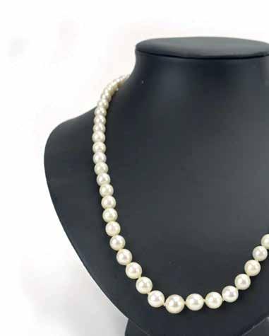747 A single strand continuous cultured pearl necklace with 18ct white gold clasp set rubies and diamonds in an openwork setting, pearls measure approximately d. 7 mm, l.