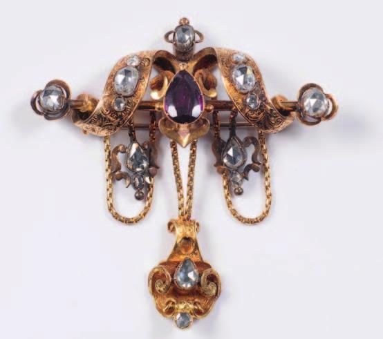 157. A mid 19th century gold, rose diamond and garnet mounted brooch of stylised ribbon design with engraved foliate