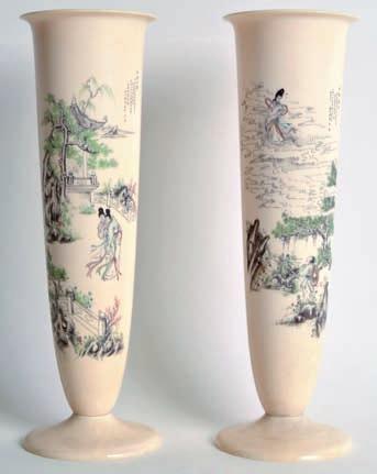 127 A PAIR OF EARLY 20TH CENTURY CHINESE CARVED IVORY VASES engraved and highlighted with ducks and birds amongst lotus. Signed. 7.5ins high.