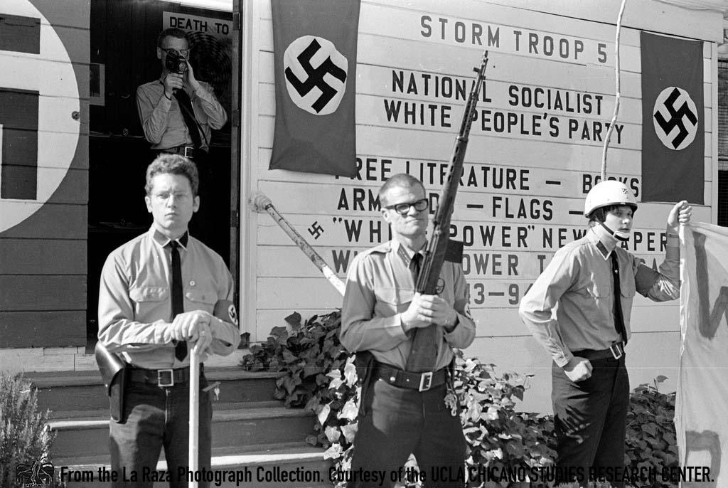National Socialist White People's Party stand armed outside a party chapter Pedro