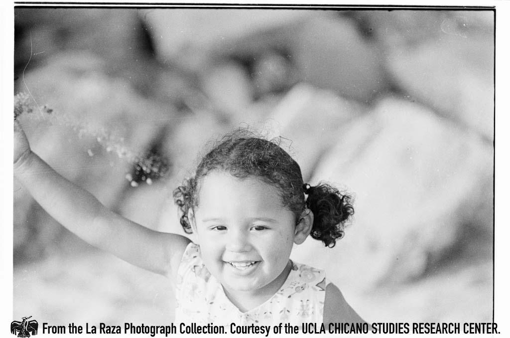 Young girl at the beach La Raza photograph