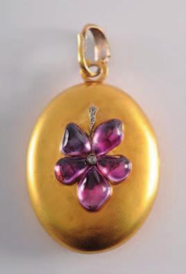 361 359. A late 19th century gold, amethyst and diamond mounted oval locket, the plain oval locket with applied cabochon amethyst and rose diamond pansy motif. 600-800. 360. No Lot. 361.