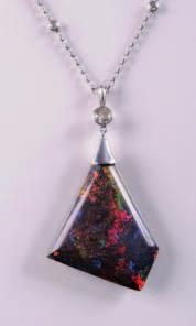 A freeform sugared opal and diamond necklace with sugared opal approximately 40mm long suspended from a round old brilliant-cut diamond on a