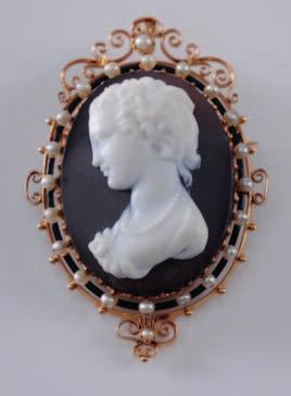 A 19th century gold and three layered hardstone cameo portrait brooch, the oval cameo panel, 43mm