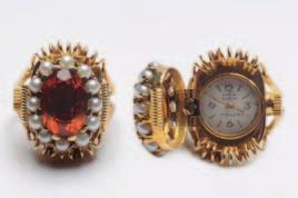 with Arabic numerals, in a case with foliate decoration, suspended from a gold, ruby and rose diamond