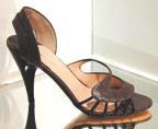 Carmen Ho has designed a spike heel, strappy black sandal embellished with a sweep of brown fur.