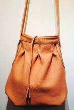 Espekt has gone all out with a bright orange tasseled square hobo bag, while their soft camel leather bag also features a tassel closure and slender strap, and works for daytime wear.