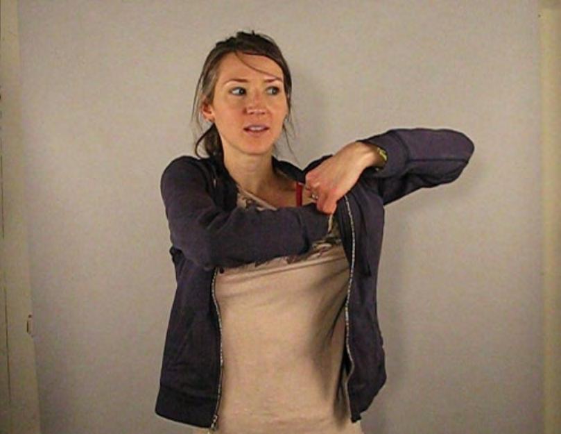 SAHAR S DRESS SHIRT LEAVES LITTLE SPACE TO MOVE BOTH OBJECT AND HAND AROUND.