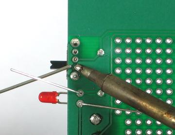 Solder in the LED and switch, watch out because the switch has