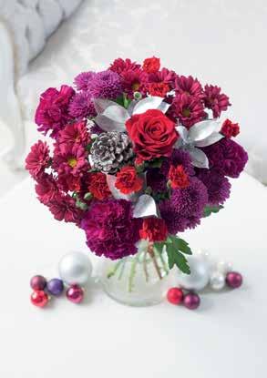 Festive Rose & Carnation A stunning festive bouquet! Featuring long lasting carnations and pretty chrysanthemums - a Christmas gift that will bring that festive feel to any home.