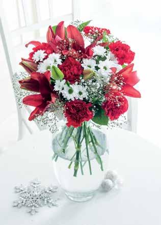 Contains red standard carnations, white/cream Kenyan roses, red spray carnations, red hypericum, white spray chrysanthemum and eucalyptus. 20.