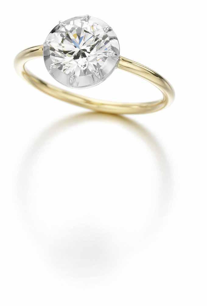 Signature Button Back Ring in 18K white and yellow gold set with one 1-carat brilliantcut diamond; the Signature Bridal collection. POA.