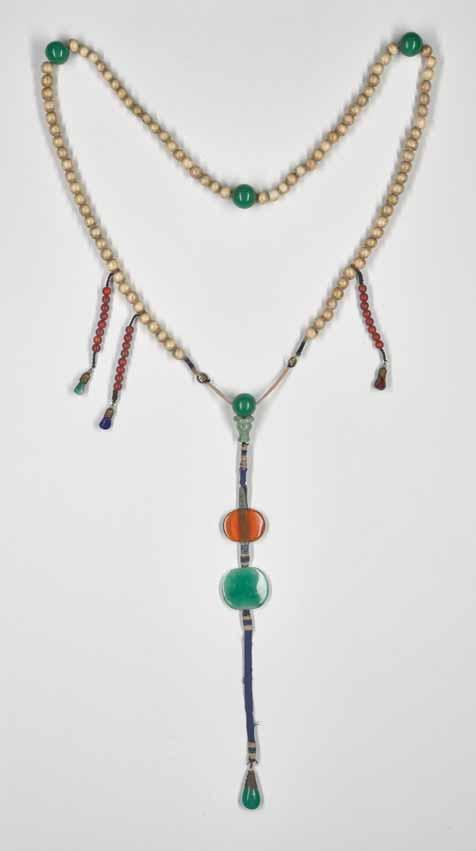 10 A GLASS AND ANTLER BEAD COURT NECKLACE, QING DYNASTY Beads of carved and partially stained antler and multicolored glass China, 19 th century Composed of one ninety one carved antler beads divided