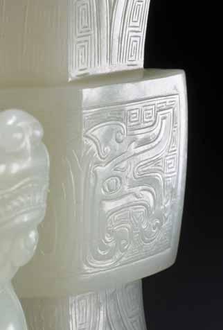 21 AN IMPORTANT MUTTON FAT WHITE JADE LION FANGGU VASE, QIANLONG PERIOD White mutton fat jade, excellent surface polish, with original ebony base, in fitted box China, Qianlong period This Qianlong