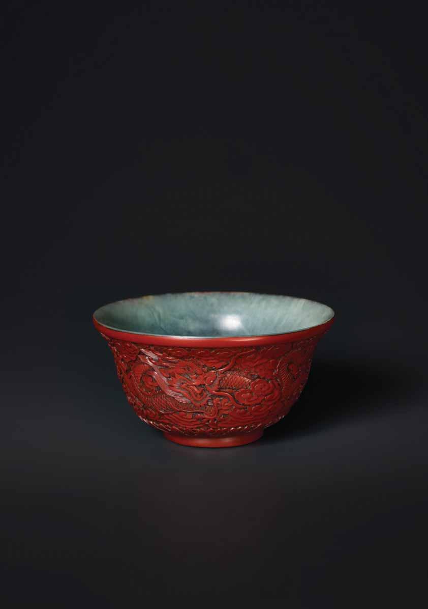 23 AN EXTREMELY RARE QIANLONG PERIOD CINNABAR LACQUER EMBELLISHED JADE BOWL Celadon and grey streaked jade, smooth surface polish, cinnabar lacquer China, Qianlong Period (1736-1795) This unique jade