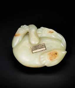 000,- Starting price EUR 500,- 25 A 17 th / 18 th CENTURY CELADON AND RUSSET JADE BUDDHIST LION CARVING Pale celadon color jade with russet inclusions, smooth surface polish China, 17 th / 18 th