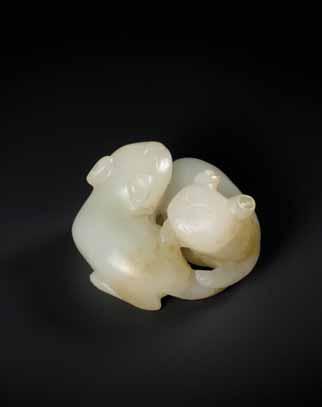 assembled in the 1930s to early 1950s Estimate EUR 400,- Starting price EUR 200,- 31 A QING DYNASTY PALE CELADON JADE CAT AND BUTTERFLY GROUP Light celadon color jade with russet inclusions, the back