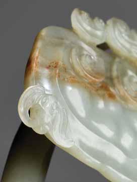 37 AN 18 TH CENTURY JADE BOY AND LOTUS CARVING Pale celadon jade of even color and