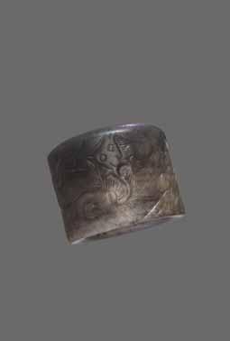 44 A MING DYNASTY MOTTLED WHITE & BLACK JADE ARCHER S RING Mottled jade ranging in color from white to black, smooth surface polish China, Ming Dynasty This Ming Dynasty archer s ring features are