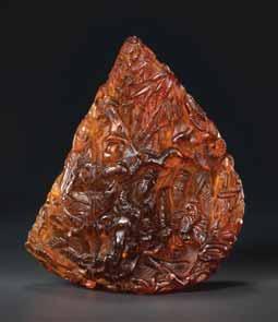 52 AN 18 th CENTURY AMBER MOUNTAIN CARVING SCHOLARS IN LANDSCAPE Amber of bright orange color of translucent quality, smooth surface polish China, 18 th century This masterful amber carving of