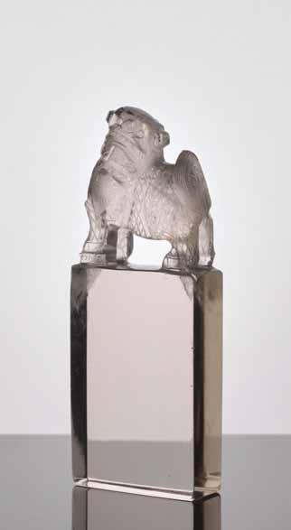 62 A QING DYNASTY ROCK CRYSTAL LITERATI SEAL GUARDIAN LION Transparent rock crystal with natural inclusions mainly to the upper part China, Qing Dynasty The rock crystal seal block of this literati