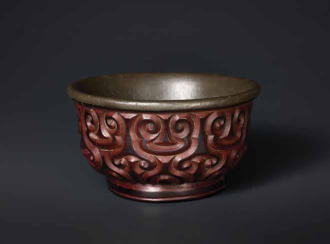 4 A SONG DYNASTY TIXI LACQUER BOWL WITH PEWTER LINING Multi-layered lacquer, interior lined with pewter China, Song Dynasty The bowl has rounded sides rising from a raised foot rim to an everted rim.