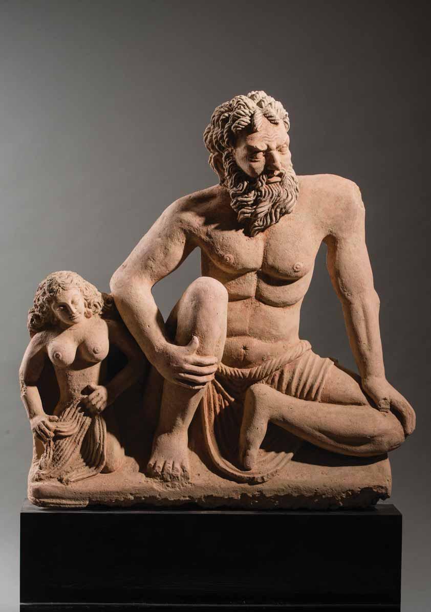 110 A MONUMENTAL HERACLES TERRACOTTA STATUE, GANDHARA, 4 th 5 TH CENTURY Terracotta, with recent wooden base, height 91 cm (without base) Ancient region of Gandhara, Kushan period 4 th 5 th century