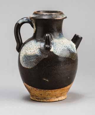116 A LARGE JIN DYNASTY HENAN CIZHOU MEIPING BOTTLE WITH RUSSET FLOWERS Ceramic with faintly speckled black glaze and brush paint in russet color China, Jin Dynasty (1125-1234) This fine and large