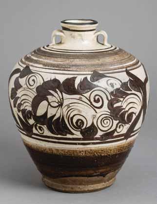 Executed with vivid brush strokes and showcasing a russet color flowers have been boldly painted onto the vessel. The foot rim and underside left unglazed, revealing the buff-colored body.