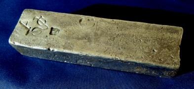 Silver Pieces-of-Eight and a silver ingot from Dutch trading ships sunk off Britain in 1742 & 1739.