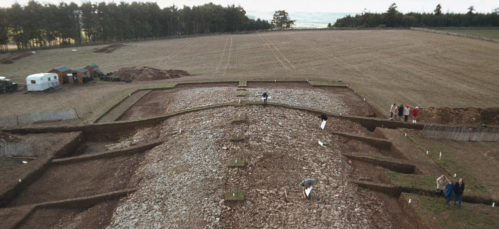 Fig. 1. Excavation of the Neolithic, 4th millennium BC, Hazleton North long barrow, Gloucestershire, in 1980. Ploughsoil stripping reveals the overlying stone cairn.