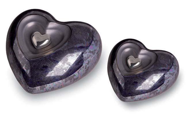Ceramic Urns continued Ornamental Urns All styles below feature a magnetic removable heart. The magnetic heart of the larger ceramic urns shown below can be fi lled with a token amount of ashes.