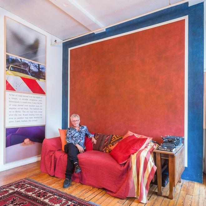 [Bill Beckley, seated in his dining room under a wall painting by Sol LeWitt alongside Beckley's own work, 'Shoulder Blade', 1978. All photos by Cameron Blaylock.