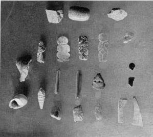 Courtesy of the Carnegie Institution of Washington (Ricketson and Ricketson 1937: Plate 67) Figure 12: Select objects from Uaxactun's Stela 4 cache including 3 "Charlie Chaplin" figures Summary of