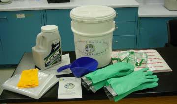 A basic spill kit should include: chemical resistant gloves, safety glasses or goggles, disposable lab coats, aprons or gowns, paper towels, spill booms or pillows, vermiculite, a small disposable
