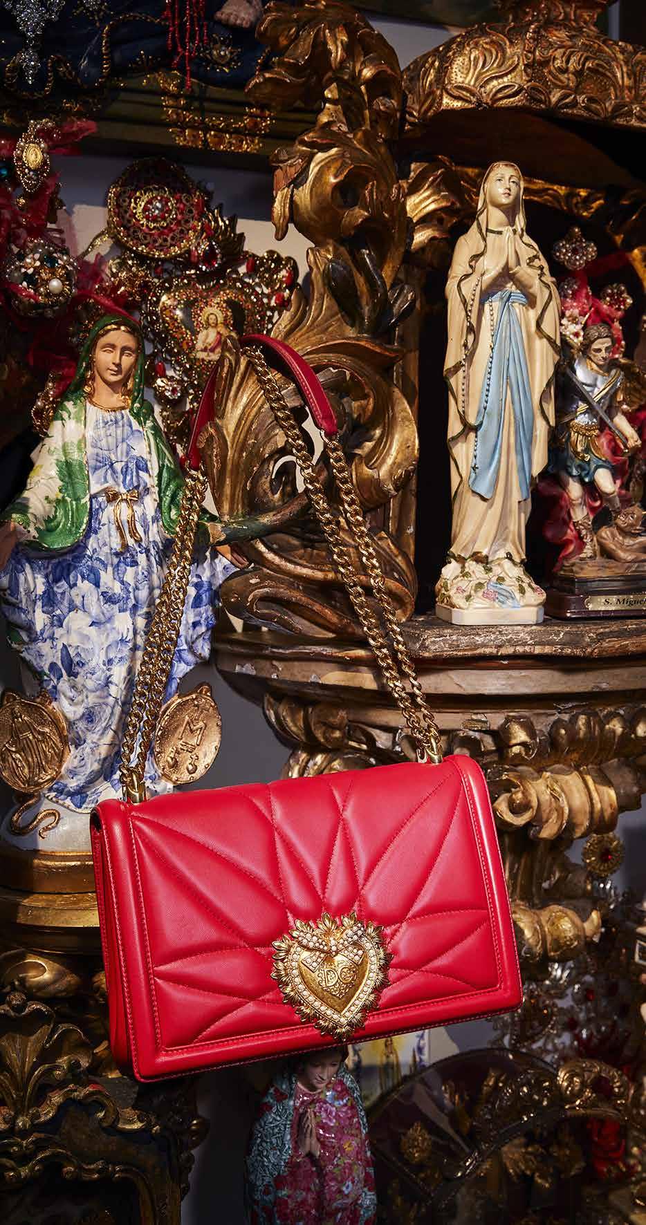 Large Devotion Bag in red quilted nappa leather, with 24K gold leaf plated shoulder chain, and central sacred heart embellishment in 24K gold leaf plated antique bronze set with pearls. POA.