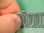 6 2) After the clip spring pin is inserted in the bracelet, use the end of the awl to push it into the