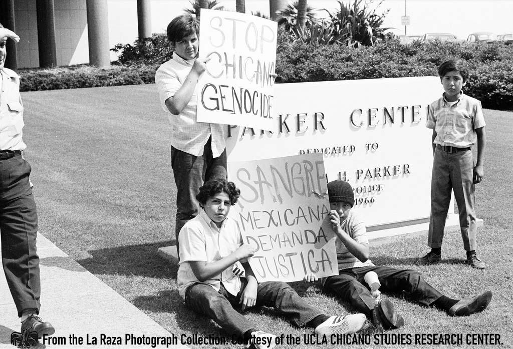 Young men protest in front of Parker Center, the headquarters of the LAPD.