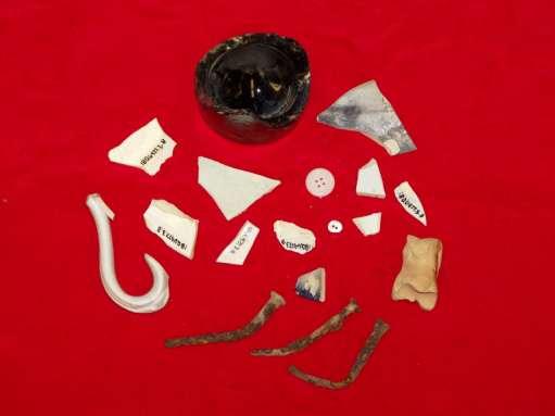Figure 5-13: Artifacts from Yard Scatter in Unit 3, Level B Personal choice and variation is apparent in a handful of other artifacts uncovered in the yard: brass, copper and shell buttons and copper