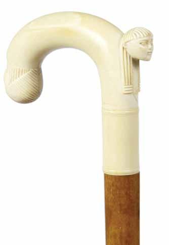 35 ½ $500-$700 129. 130. Ivory Leg Ca. 1890-A stylized ivory naughty leg, horn and ivory disc collar, ebony shaft and a metal H. 2 ¼ x 1 ½, O.L. 35 $350-$500 131. Large Bulldog Ca.