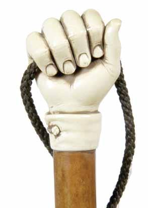 134. Ivory Fist Pre-Ban-A large carved ivory fist holding a lanyard, carved ivory cuff collar, thick malacca shaft and an ivory H. 2 ¼ x 1 ¾ x 2 ¼, O.L.